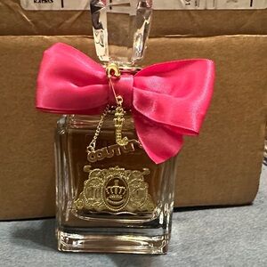 Juicy Couture Fragrance with Pink Ribbon and Gold Accents